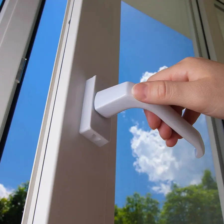 A person opening the window with a remote control.